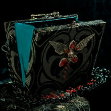 Load image into Gallery viewer, Black and gold winged skull hand bag