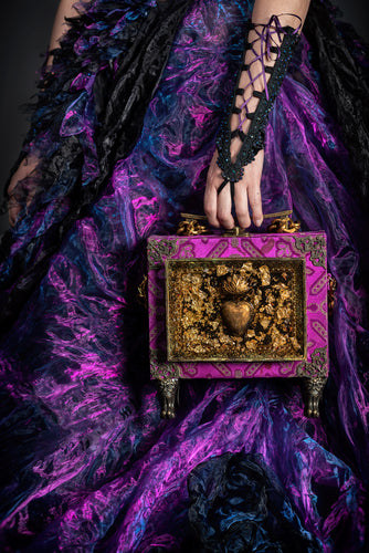 Sacred heart in resin on purple brocade handbag