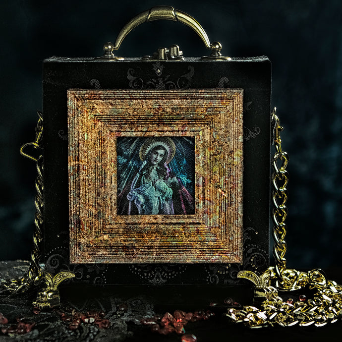 Virgin and child on black and gold velvet hand bag