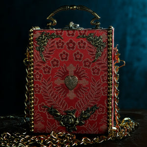 Red brocade handbag framed whith golden spikes