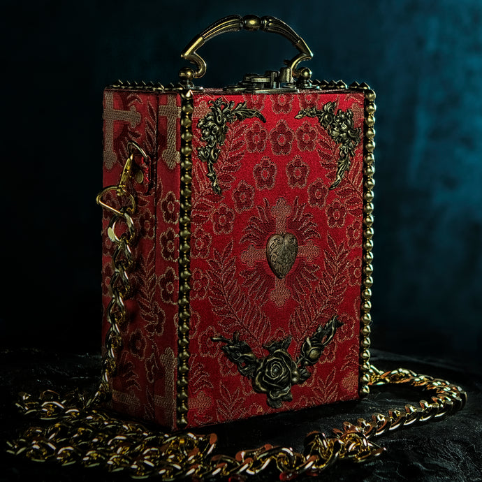 Red brocade handbag framed whith golden spikes