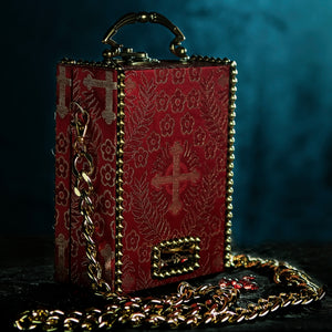 Red brocade handbag framed whith golden spikes