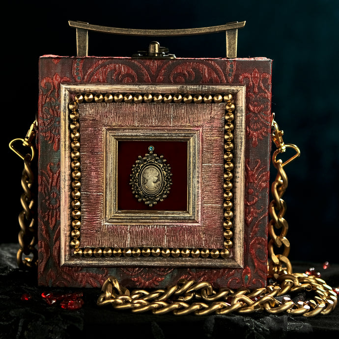 Framed victorian cameo on red and cyan brocade hand bag