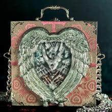 Load image into Gallery viewer, Elizabeth&#39;s hands in a hand carved heart frame hand bag