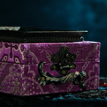 Load image into Gallery viewer, Framed raven head on purple and silver brocade hand bag