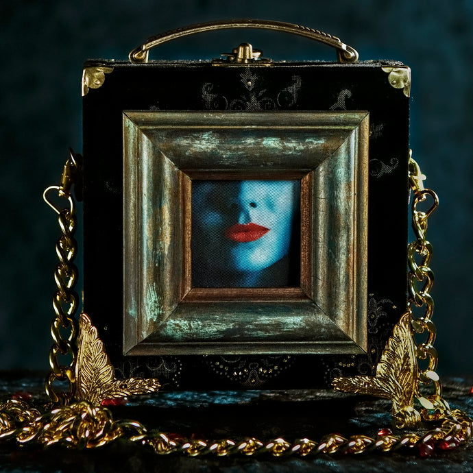 Framed Kali mouth on black velvet brocade hand bag