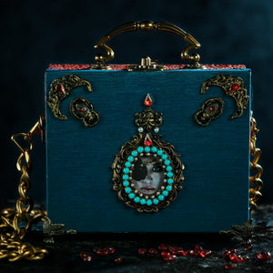 Ana de Mendoza framed eye on turqoise taffeta handbag