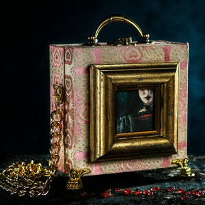 Framed Joan the Mad lips on a pink brocade handbag