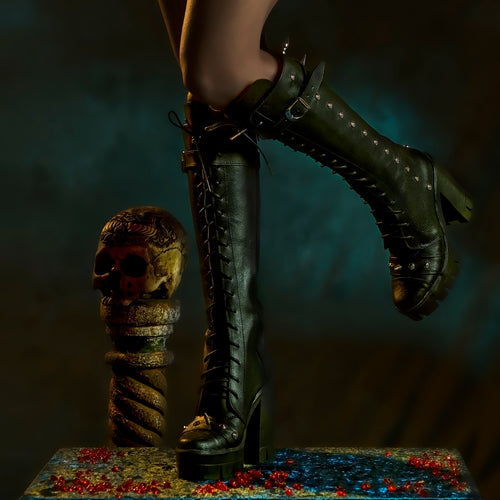 Black leather boots with spikes