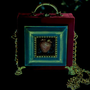 Resin heart in a blue frame hand bag