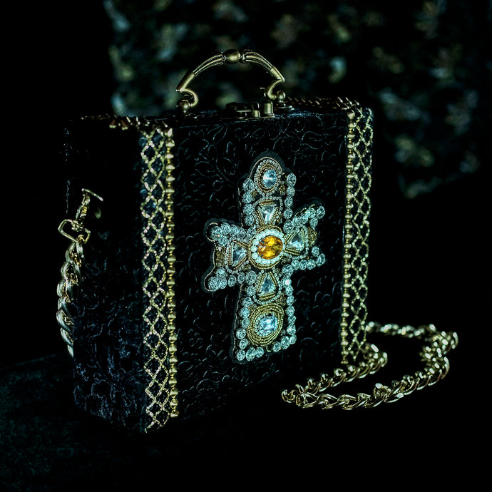 Yellow and clear rhinestones cross on black velvet hand bag