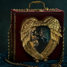 Load image into Gallery viewer, Kaos goddess in a hand carved heart frame hand bag