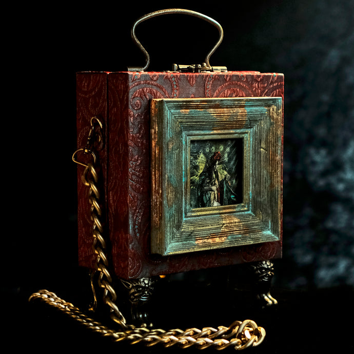 Framed Virgin of Quito on a red and cyan brocade