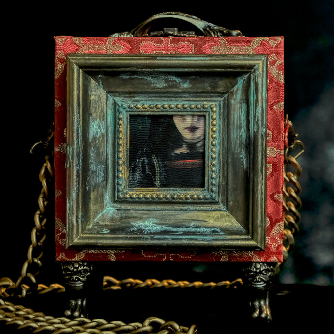 Framed Joan the Mad lips on a deep red brocade handbag